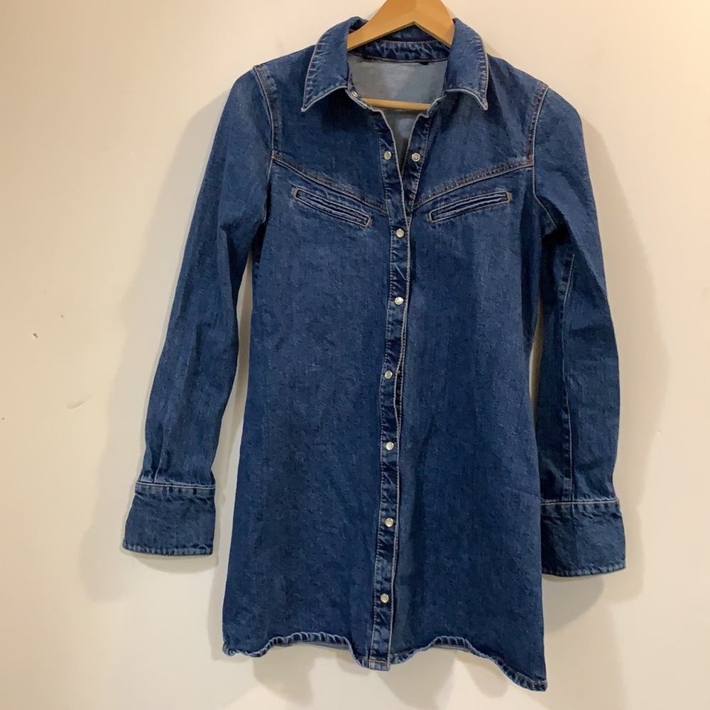 Yellowstone western flare jean/denim shirt or dress with pearl snap buttons.